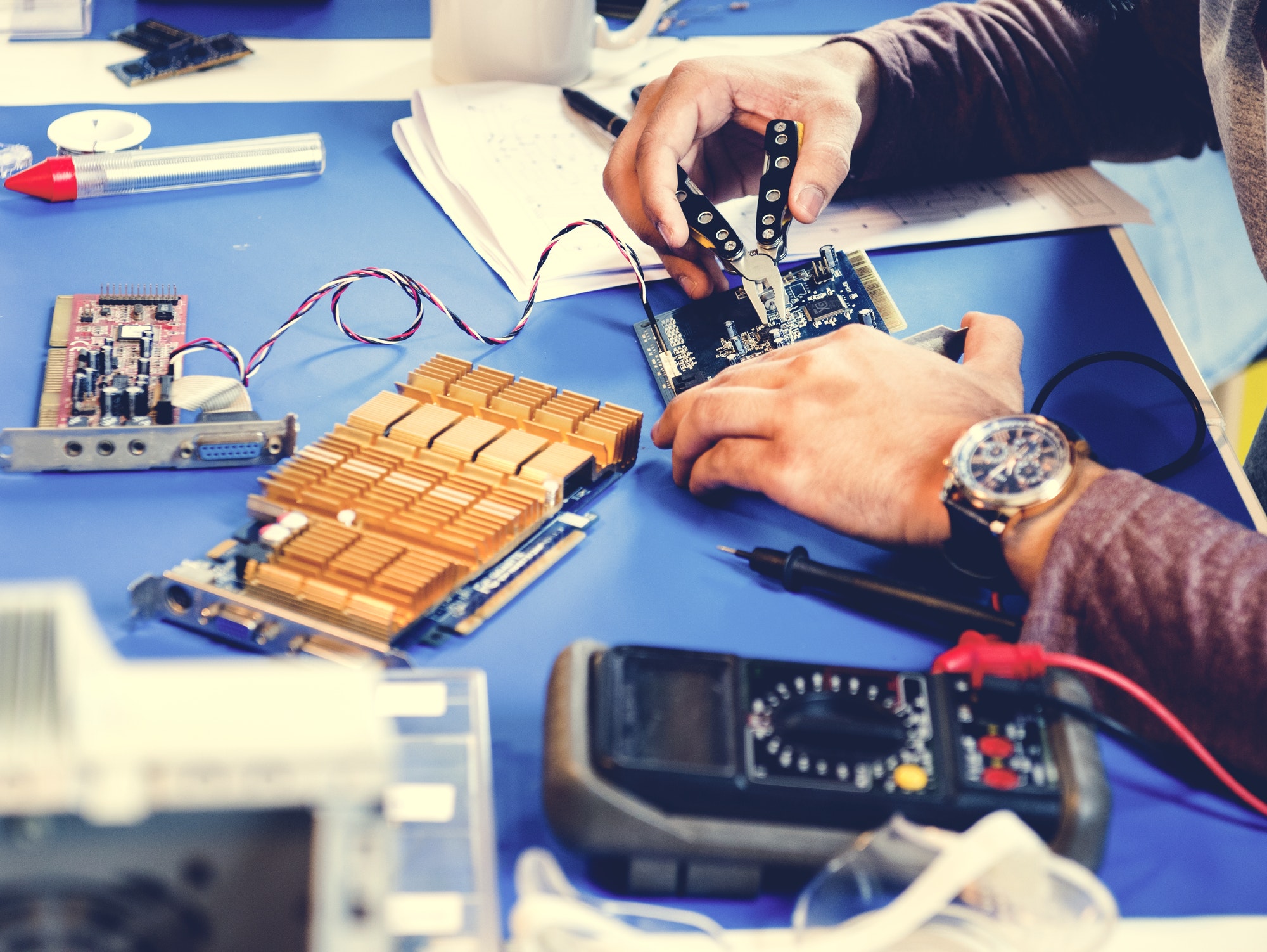 Technicians working on electronics parts